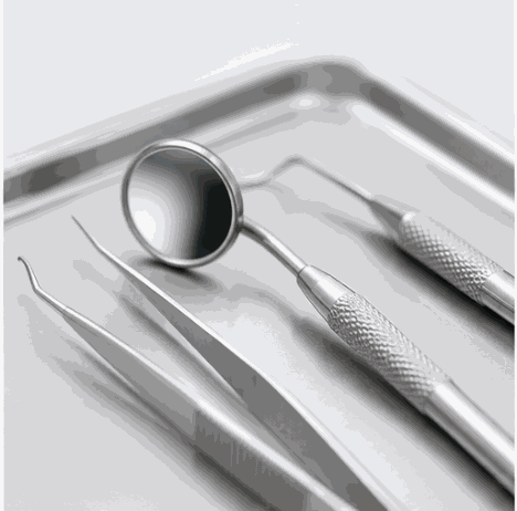 Sterilized dental instruments arranged on a metal tray