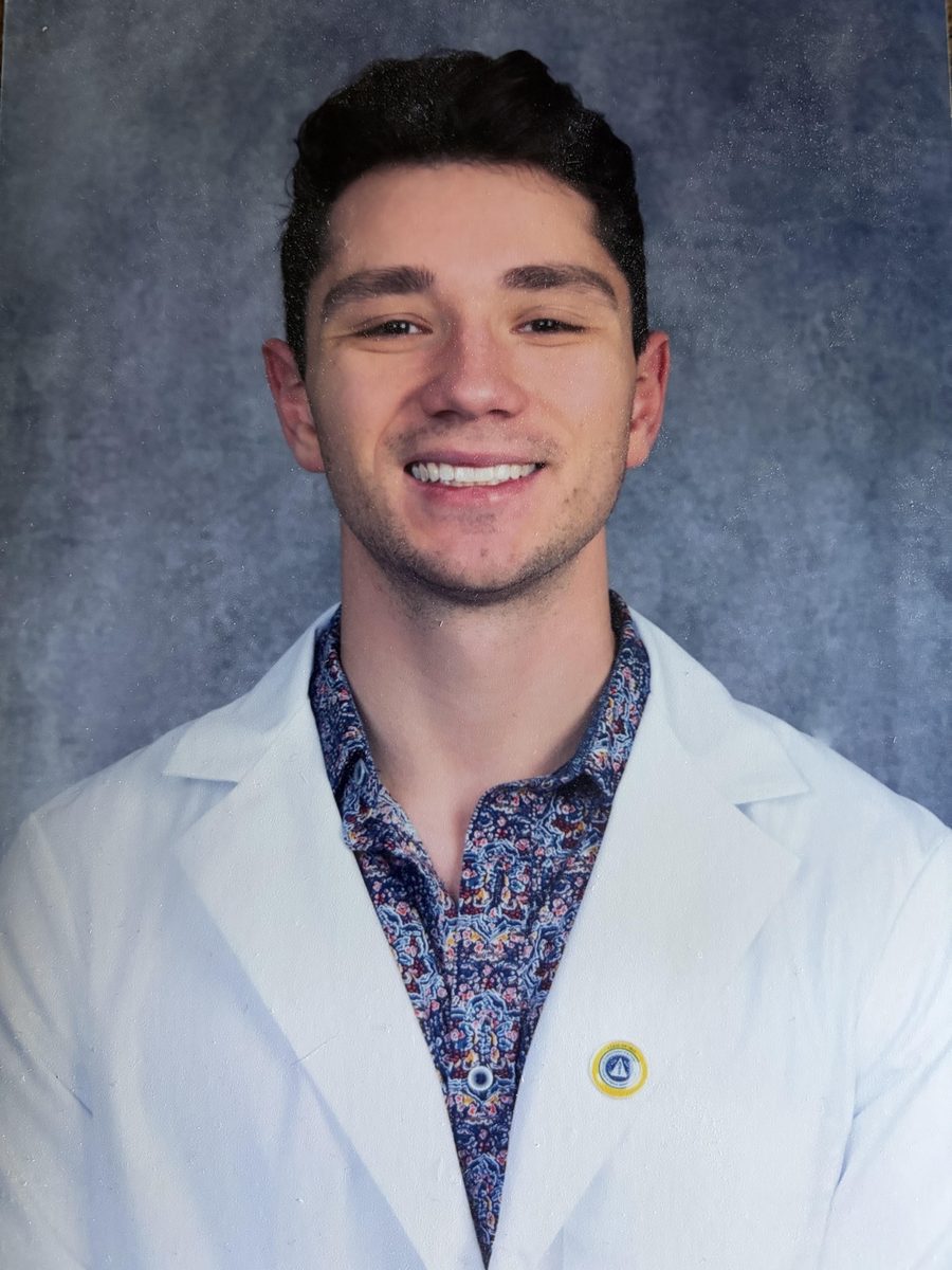 Dr. LaRocca, dentist at Lake Street Smiles, smiling in a white coat