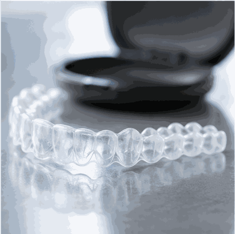 Clear Invisalign aligner tray with its case